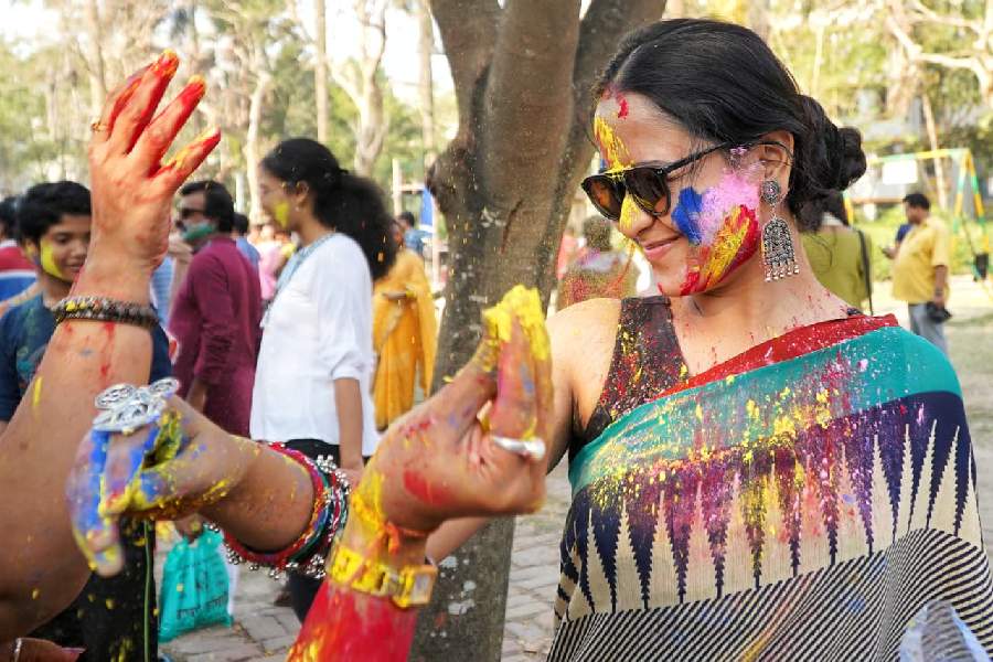 Residents of an apartment complex in south Kolkata play Holi 