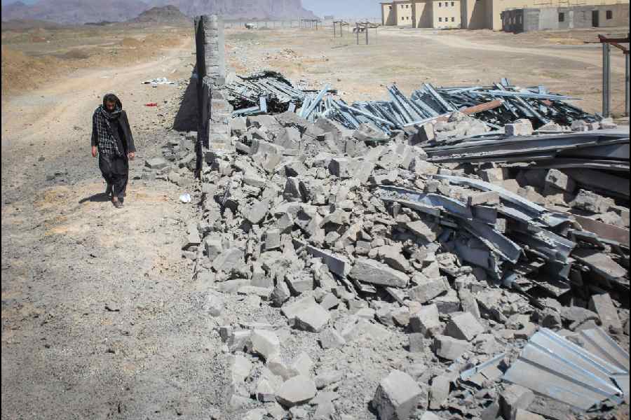 An Afghan man walks past a damaged wall following airstrikes, amid the conflict between Afghanistan and Pakistan, in Kandahar, Afghanistan, February 28, 2026.