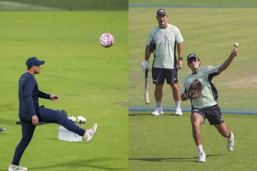 (l-r) South Africa opener and wicketkeeper Quinton de Kock plays a bit of football during the Proteas’ practice session on the eve of the semi-final. Spinner all-rounder Rachin Ravindra warms up for Wednesday’s semi-final against South Africa 