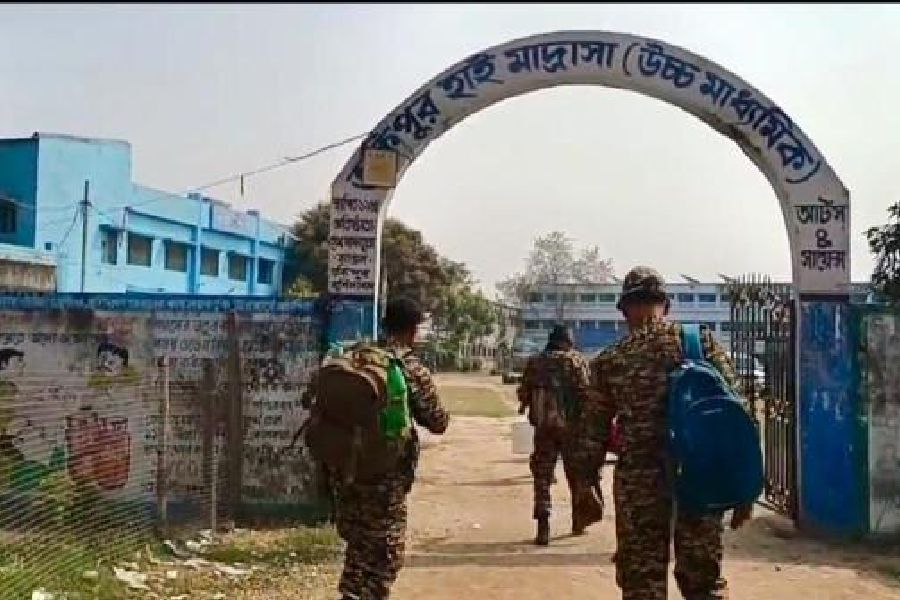 Central force personnel enter the Takipur High Madrasa in Murshidabad’s Rejinagar earlier this week.Picture by Abdul Halim