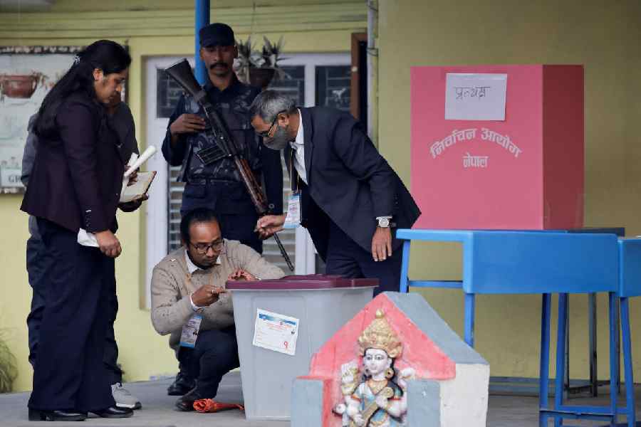 Polling officials seal a ballot box at a polling station during the general election, in Kathmandu, Nepal, March 5, 2026.