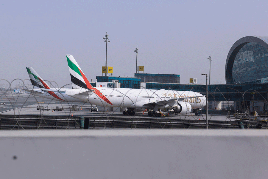 FILE PHOTO: Planes are parked at Terminal 3 of the Dubai International Airport, following the United States and Israel strikes on Iran, in Dubai, United Arab Emirates, March 2, 2026.