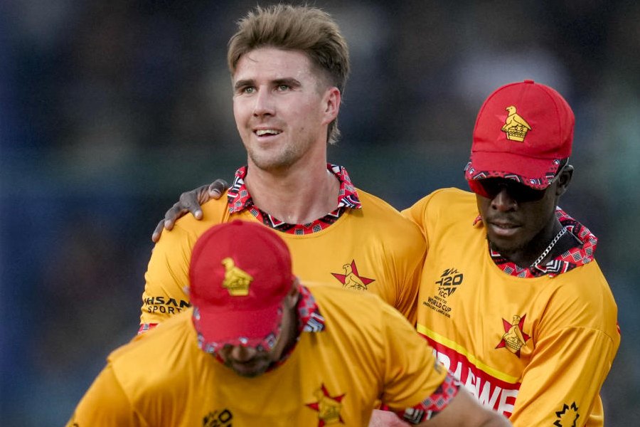 Zimbabwe's Brad Evans with teammates