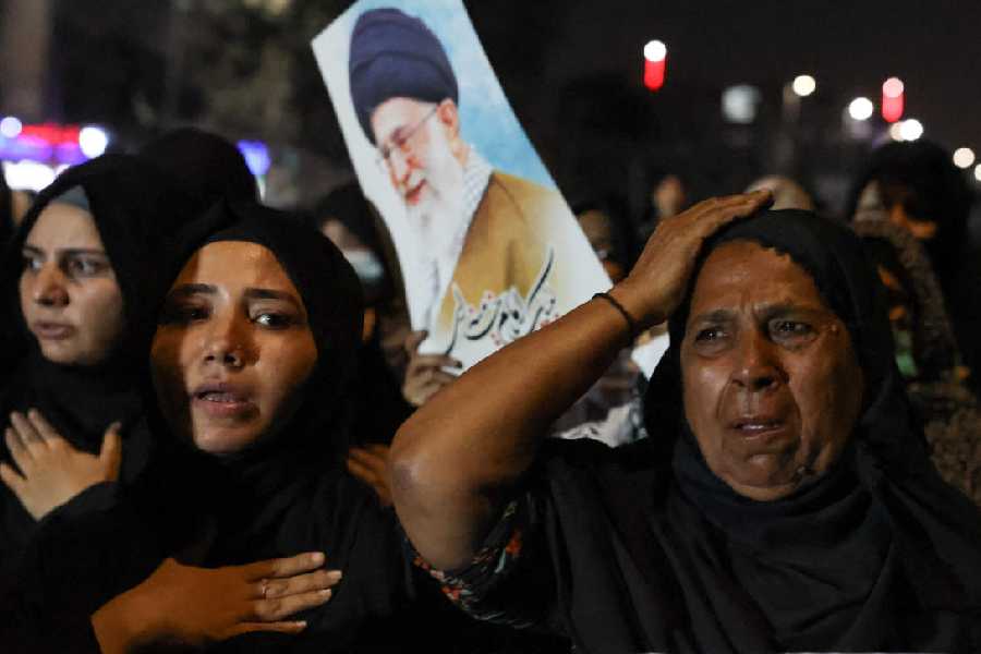 Shiite Muslim women in Karachi, Pakistan mourn the death of late Iran's Supreme Leader Ayatollah Ali Khamenei