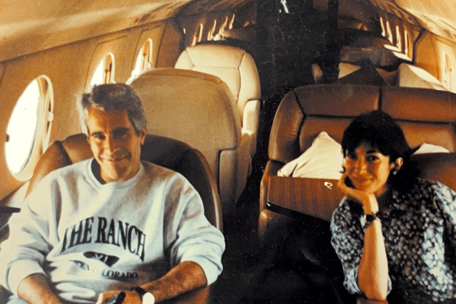 FILE PHOTO: Ghislaine Maxwell and Jeffrey Epstein are seen in this image released by the Department of Justice in Washington, D.C., U.S., on December 19, 2025 as part of a new trove of documents from its investigations into the late financier and convicted sex offender Jeffrey Epstein.