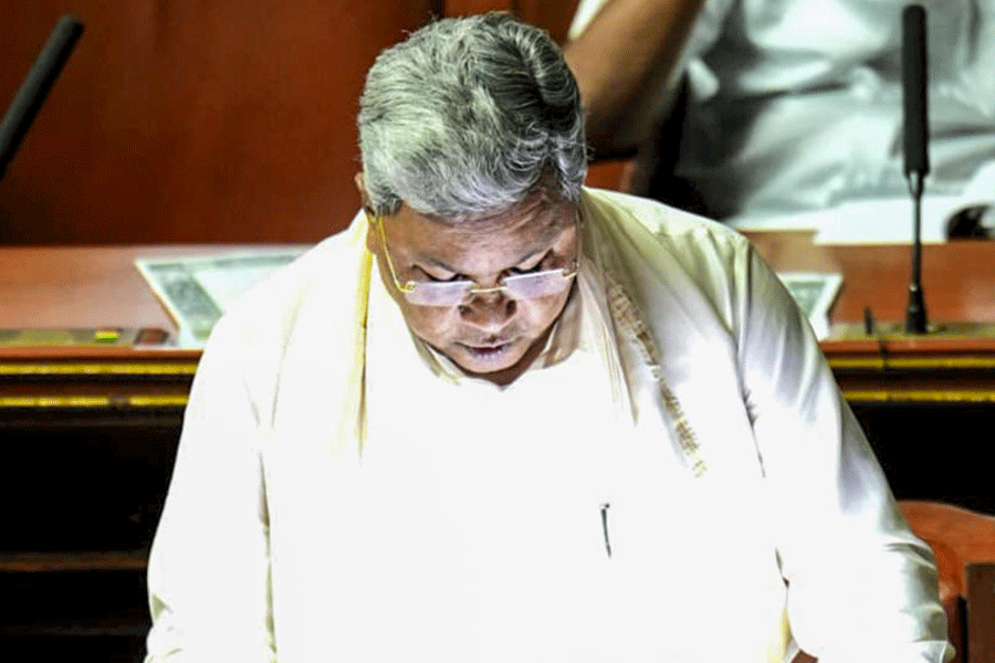 In this image received on March 6, 2026, Karnataka Chief Minister Siddaramaiah, who also holds the Finance portfolio, presents the state Budget for the financial year 2026-27, at Vidhana Soudha, in Bengaluru.
