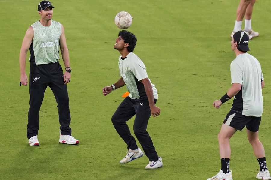 New Zealand’s (from left) Lockie Ferguson, Rachin Ravindra and Matt Henry during a practice session in Ahmedabad on Friday.