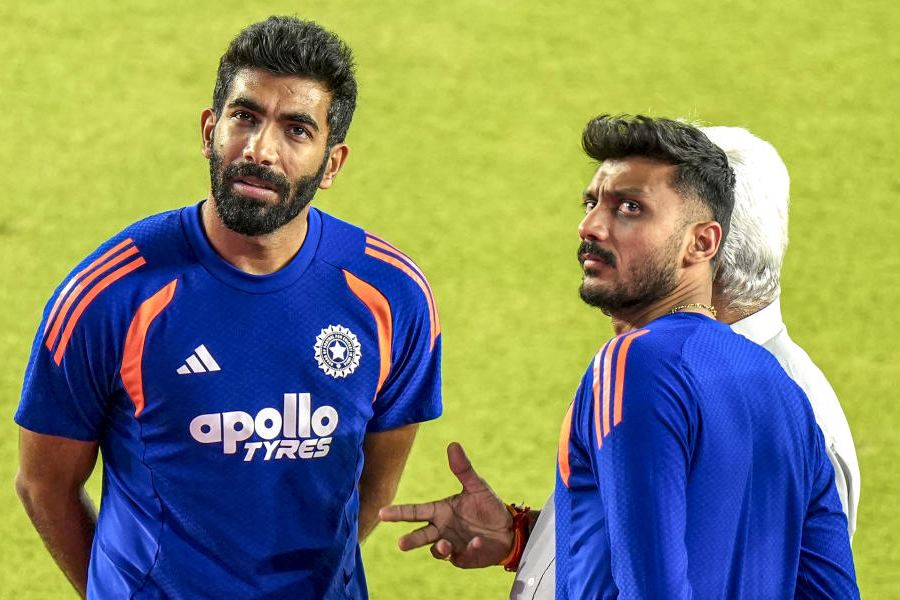 India's Jasprit Bumrah, left, and Axar Patel during a training session on the eve of the ICC Men's T20 World Cup 2026 final cricket match between India and New Zealand, at the Narendra Modi Stadium in Ahmedabad, Gujarat, Saturday, March 7, 2026.