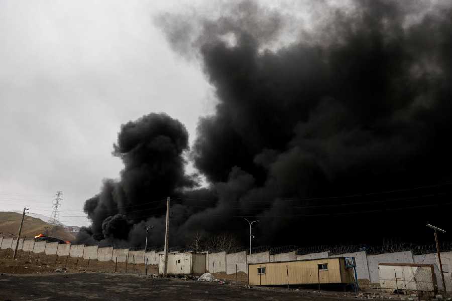 Smoke rises after a reported strike on Shahran fuel tanks, amid the U.S.-Israeli conflict with Iran, in Tehran, Iran, March 8, 2026