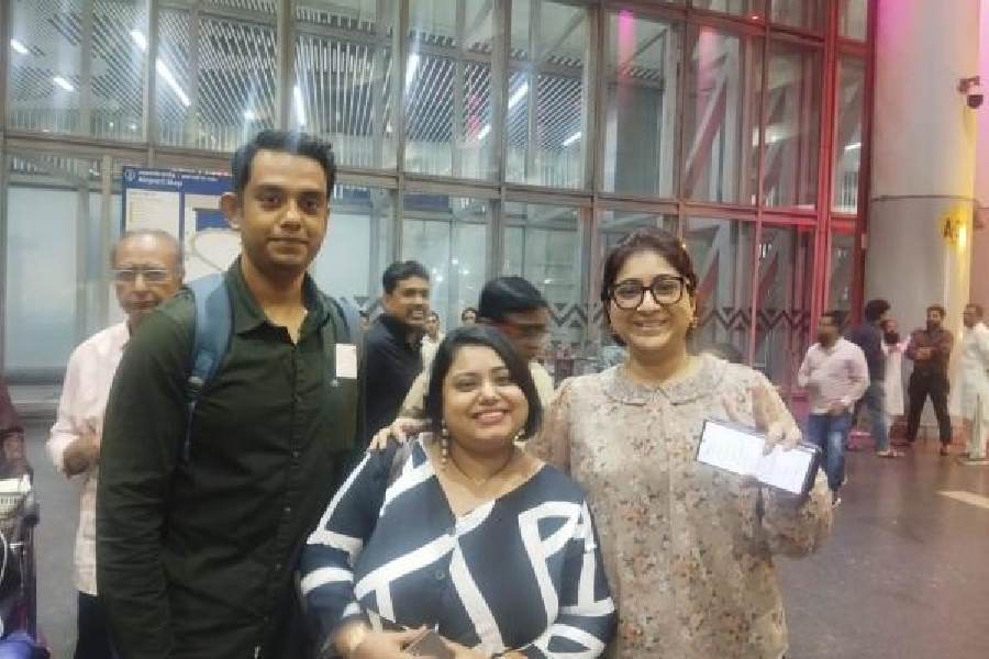 (From left) Srijit Banerjee, Saheli Banerjee and Sushmita Auddy at Kolkata airport on Sunday