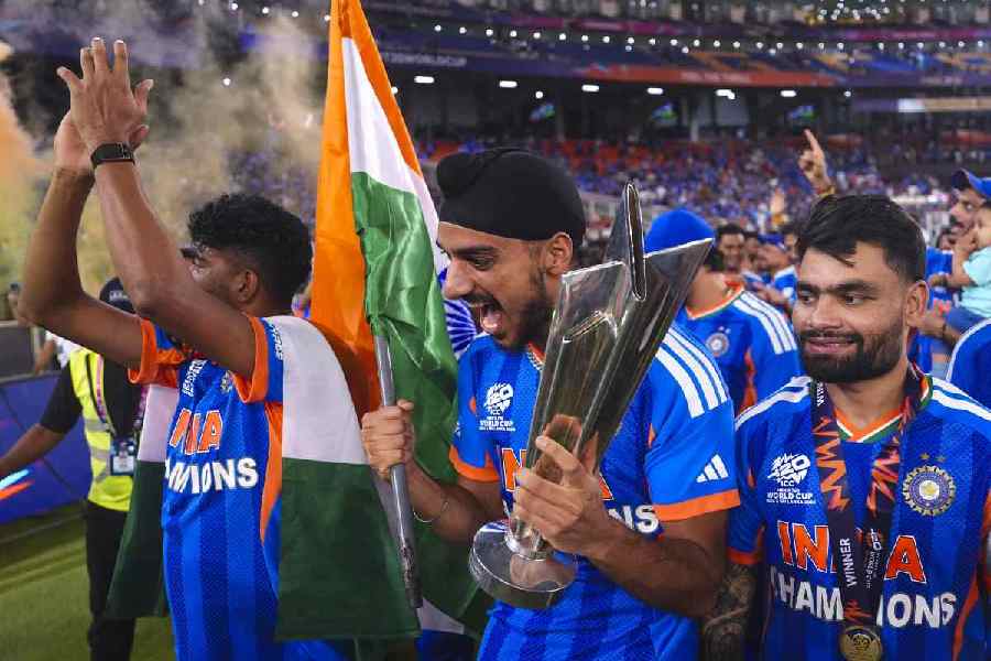India's Arshdeep Singh, Rinku Singh and others celebrate with the tournament trophy after India won the ICC Men's T20 World Cup 2026