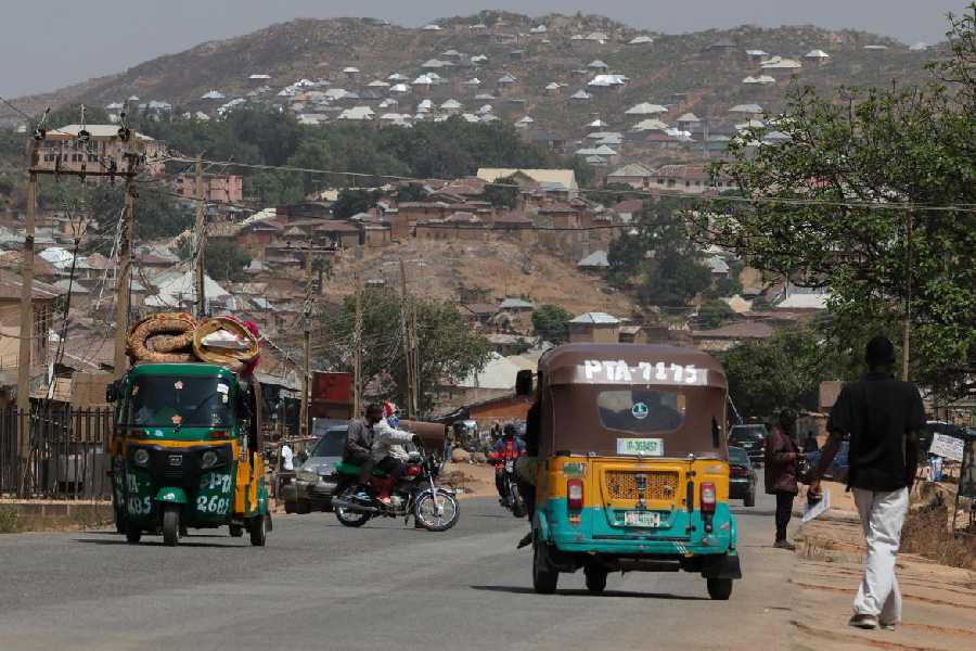 Motorists and pedestrians commute on a major road in Jos, Plateau State, north central Nigeria, March 5, 2026