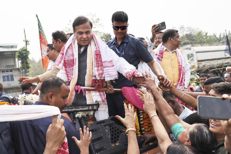 Assam Chief Minister Himanta Biswa Sarma greets supporters during the BJP's Jana Ashirwad Yatra ahead of the 2026 Assembly elections at Pathshala, in Bajali district of Assam, Monday, March 9, 2026