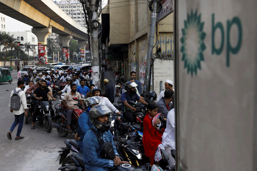 FILE PHOTO: Vehicles queue at a fuel station, as concerns grow over fuel supplies following U.S.-Israel conflict with Iran, in Dhaka, Bangladesh, March 6, 2026.