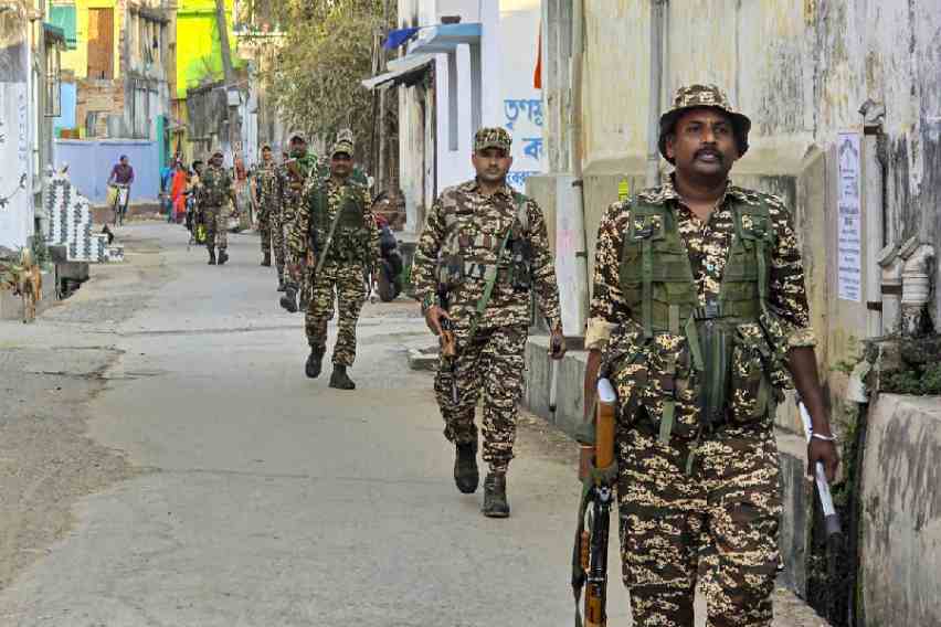 Security personnel patrol a street in Birbhum, ahead of the announcement of the Assembly polls. (PTI picture)