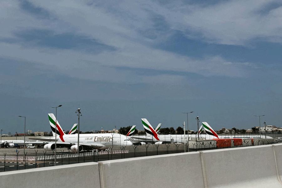 Emirates' planes sit on the tarmac of Dubai International Airport (DXB) after two drones came down in the vicinity of the airport, amid the U.S.-Israeli conflict with Iran, in Dubai, United Arab Emirates, March 11, 2026.