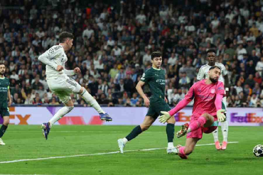 Federico Valverde scores the third goal for Real Madrid in their round-of-16 first-leg match of the Champions League at the Bernabeu on Wednesday. (Reuters)
