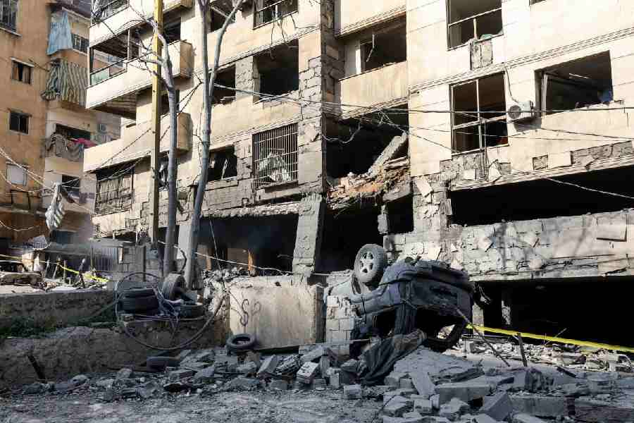 A destroyed vehicle amid rubble in the aftermath of yesterday's Israeli strikes on Bachoura neighbourhood, following an escalation between Hezbollah and Israel amid the U.S.-Israeli conflict with Iran, Lebanon, March 13, 2026.