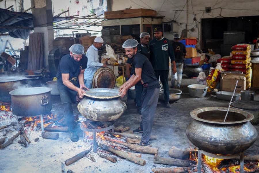 Biryani being prepared on firewood at Arsalan’s  central kitchen on Friday.