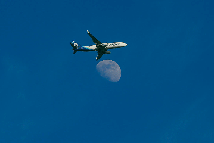 An Alaska Air Boeing 737 MAX flies over downtown Seattle toward SeaTac Airport, in Seattle, Washington, U.S. February 26, 2026.