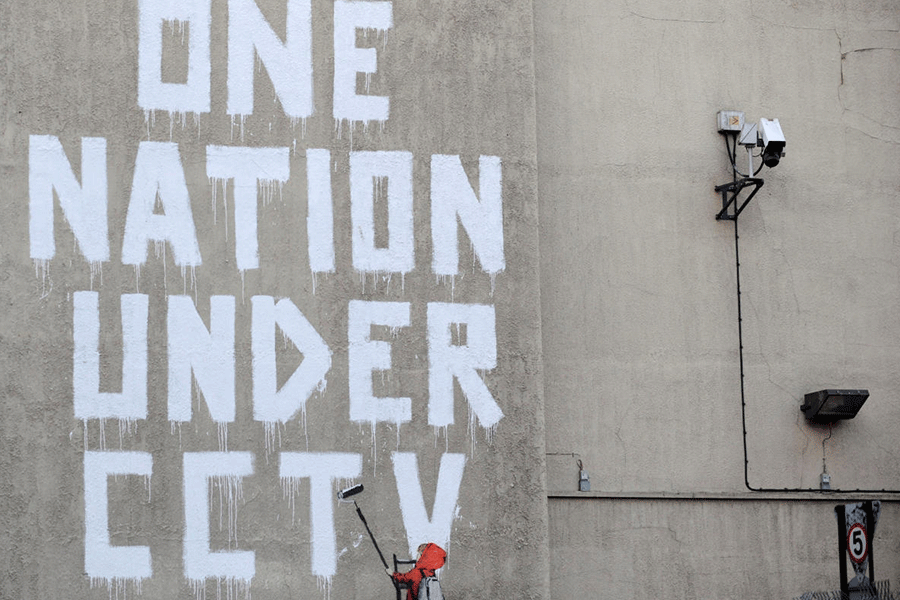 Street graffiti by elusive graffiti artist Banksy is seen on a wall in central London