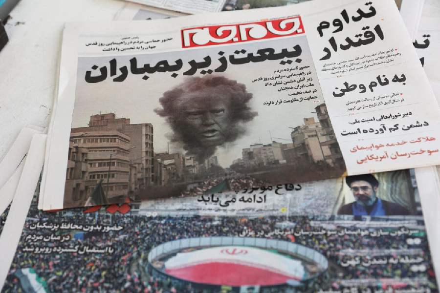 Iranian newspapers with cover photos related to the annual al-Quds Day (Jerusalem Day) protests, amid the US-Israeli conflict with Iran, in Tehran, Iran, March 14, 2026.
