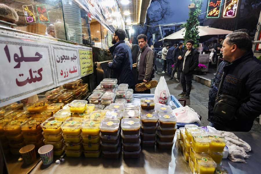 A restaurant displays meals for sale outside, amid heightened tensions linked to the US-Israeli conflict with Iran, in Tehran, Iran, March 13, 2026.