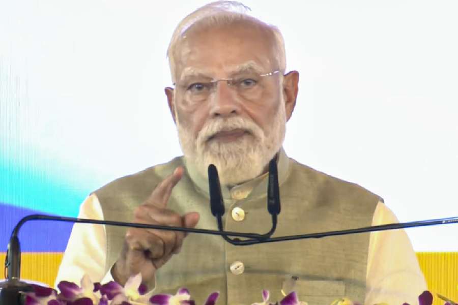 Narendra Modi addresses a gathering during the foundation stone laying and unveiling ceremony of various development works, in Kolkata