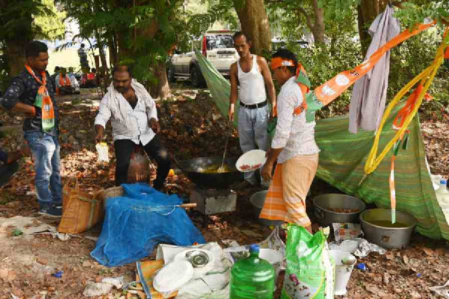 A man atop a gas cylinder used to cook on the Maidan on Saturday