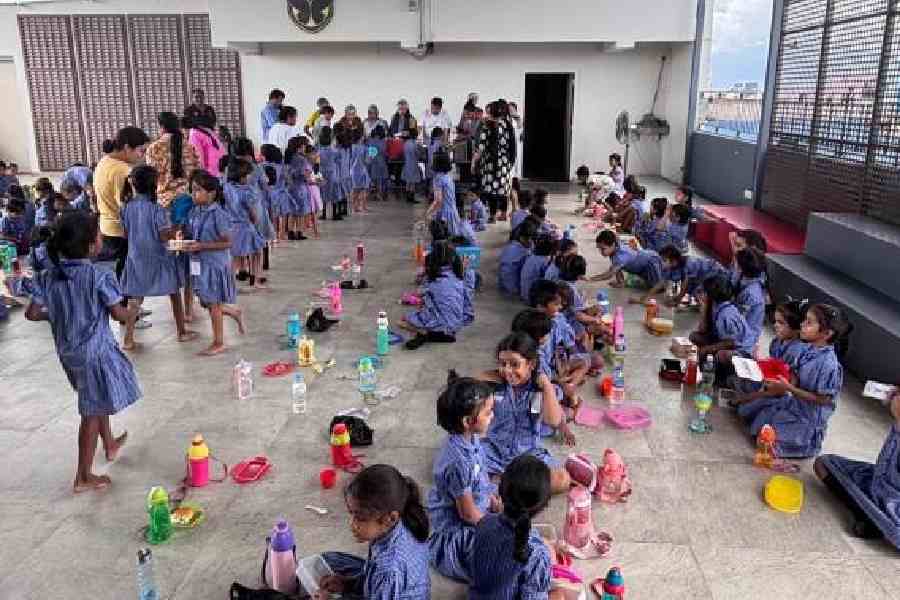 Children at Ek Tara being served a meal