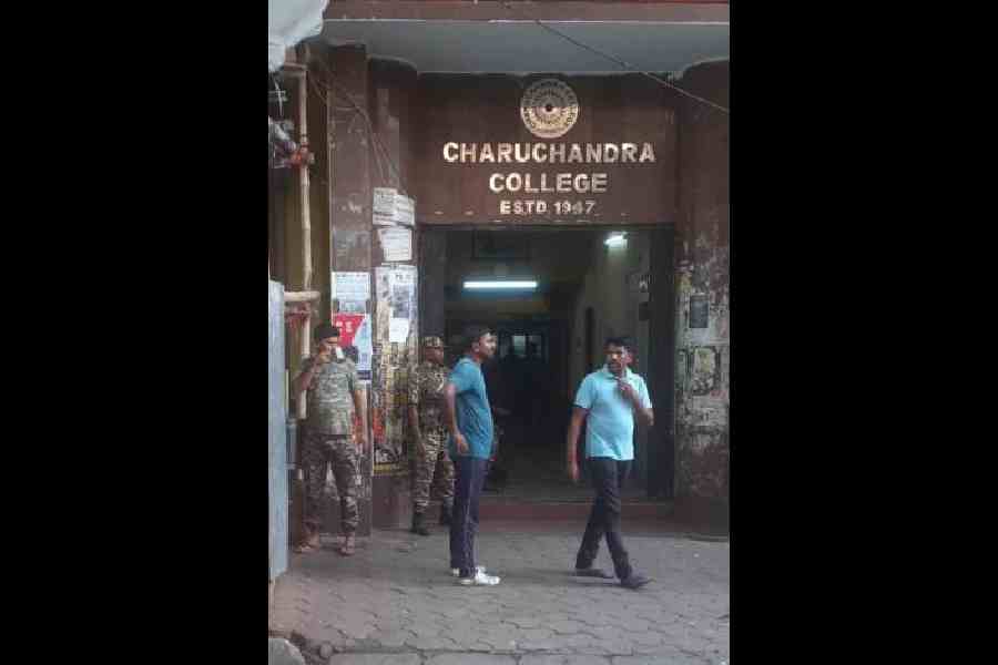 CAPF personnel stand guard outside Charuchandra College on Saturday