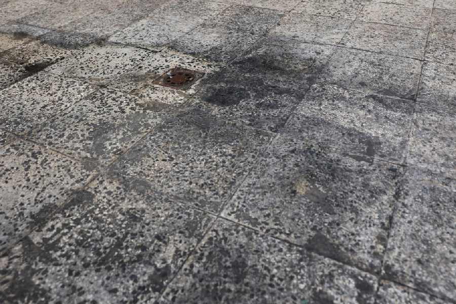Black soot on the floor of a roof after reported black rain following a strike on fuel tanks, amid the U.S.-Israeli conflict with Iran, in Tehran, Iran
