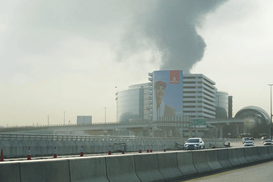 Smoke rises from the Dubai International Airport