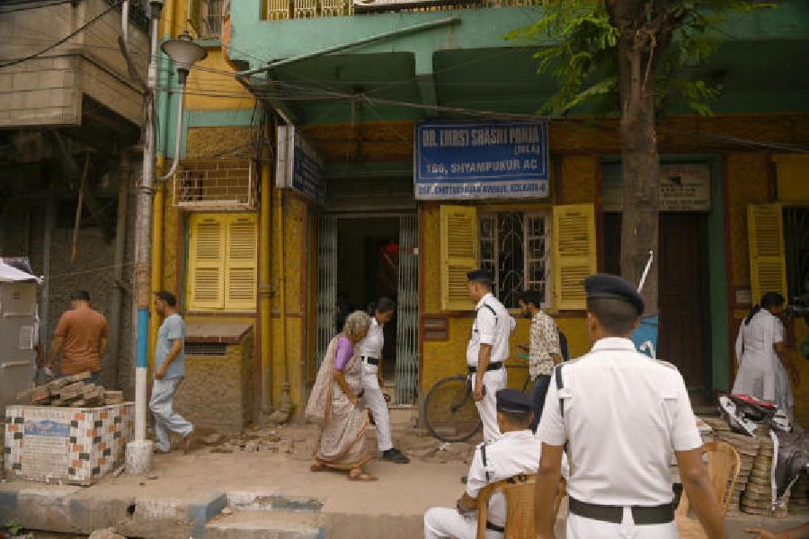 Police personnel outside Shashi Panja’s home on Sunday afternoon.