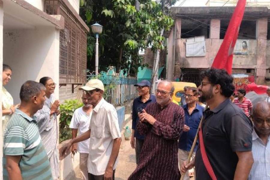 CPM leader Bikash Bhattacharya, along with party workers, in a public outreach programme at Jadavpur in Calcutta on Sunday