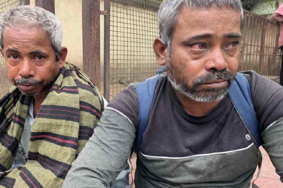 Harihara, son of victim Cheru Parida, breaks down outside the SCB Medical College and Hospital on Monday.