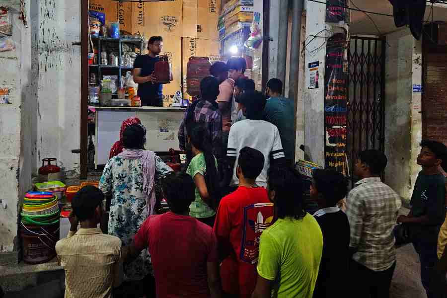 A huge crowd in front of a local shop in Sector 15, Noida, to refill the LPG cylinders.