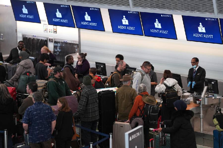 Travelers queue in Terminal 1 at Minneapolis airport after snowstorm