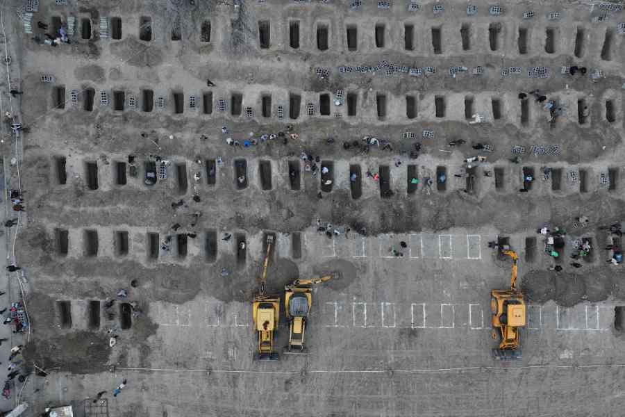 Graves being prepared for the victims of the strike on a school in Minab, Iran