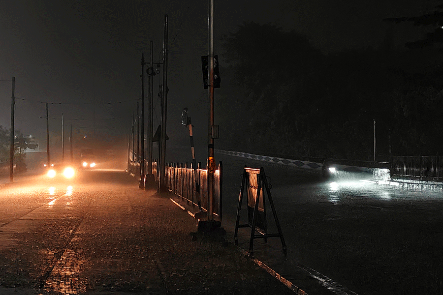 People commute during rainfall in Kolkata