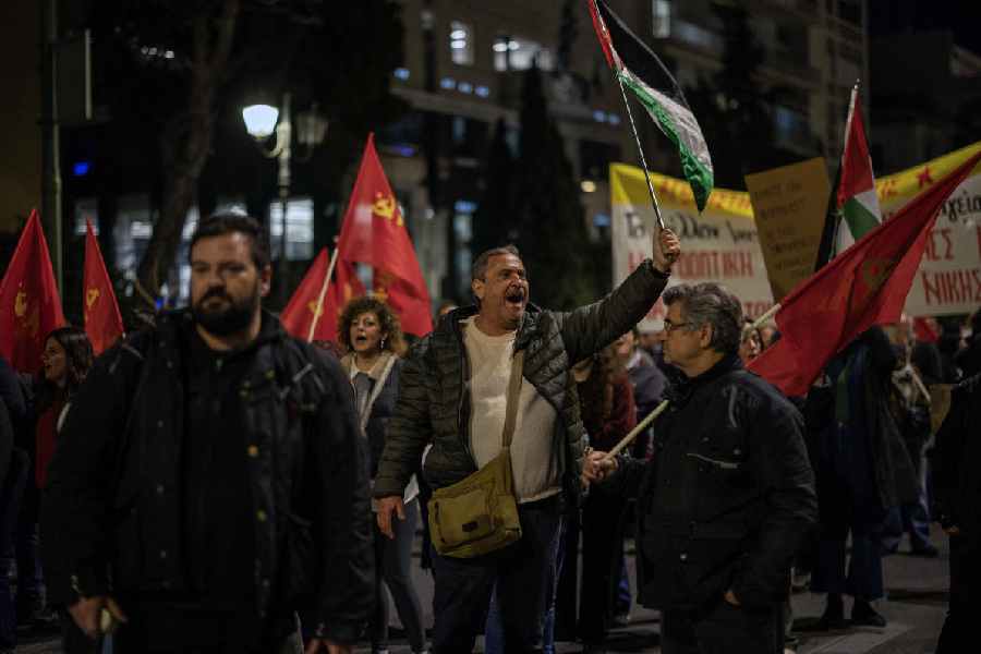 Protesters shout slogans during an anti-war march to the U.S. embassy over the war in Iran and military mobilization in the Eastern Mediterranean, in Athens, Greece, March 12, 2026.