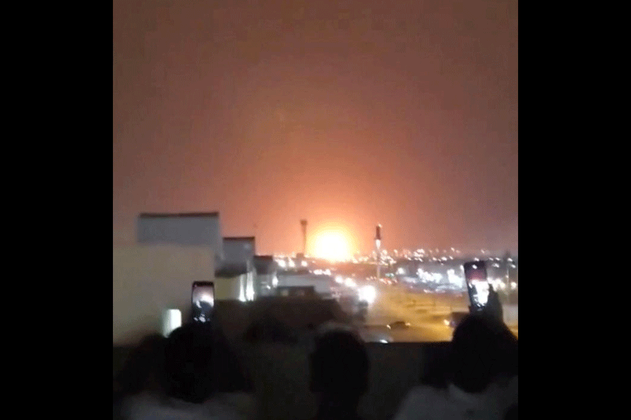 Fire rises from an explosion following a strike near oil company Aramco, in Riyadh