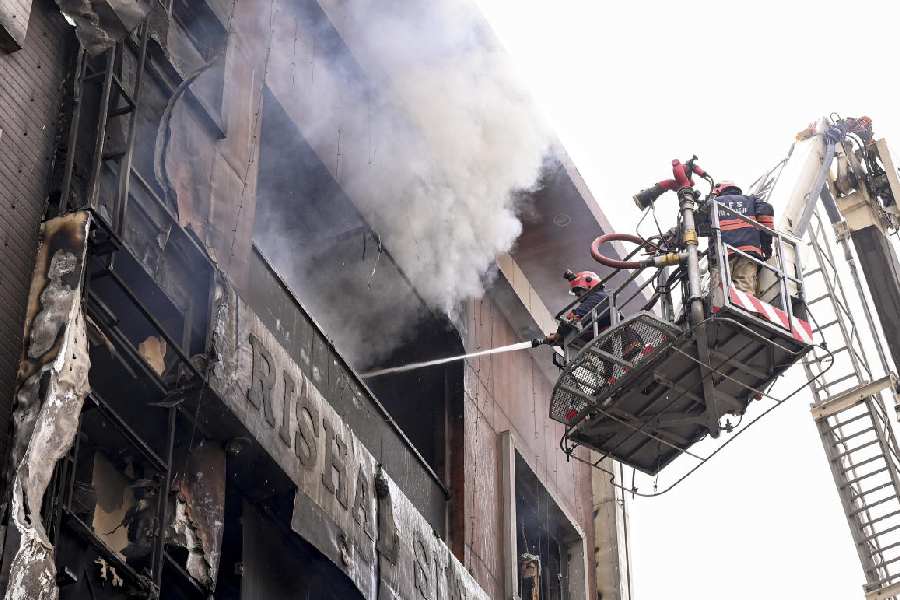 Rescue operations underway after a fire broke out in a residential building near Palam Metro station, in New Delhi, Wednesday, March 18, 2026.