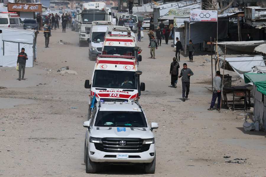 A UN vehicle leads ambulances carrying war-wounded people and patients who leave Gaza, for treatment abroad, through the Rafah border crossing between Gaza and Egypt after it was opened by Israel on Thursday for a limited number of people