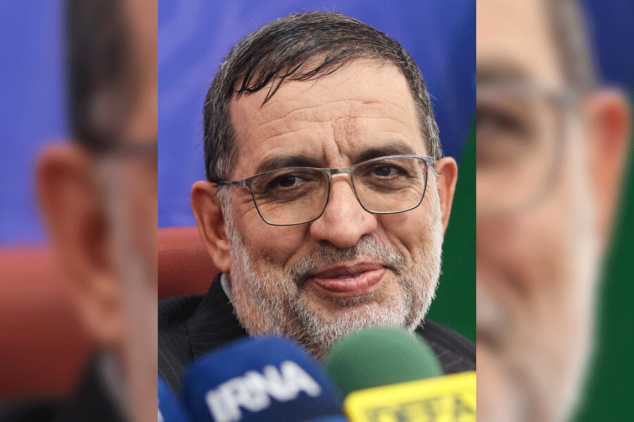 A firefighter works to extinguish a fire at the site of a direct hit from an Iranian missile in central Israel, Wednesday, March 18, 2026.
