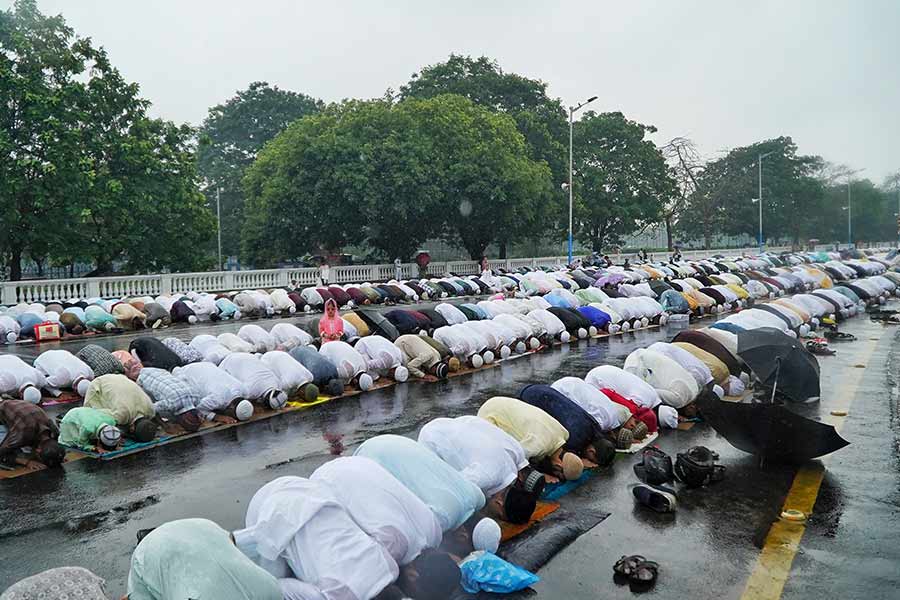 At Red Road, long rows of worshippers stretched across a rain-drenched street