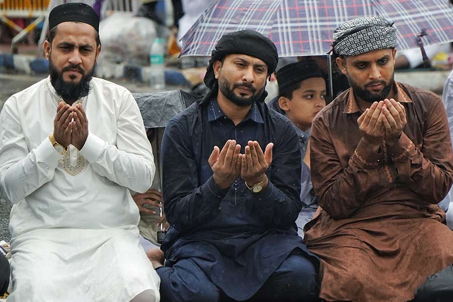The steady drizzle made the ground slick, but the congregation continued with discipline 