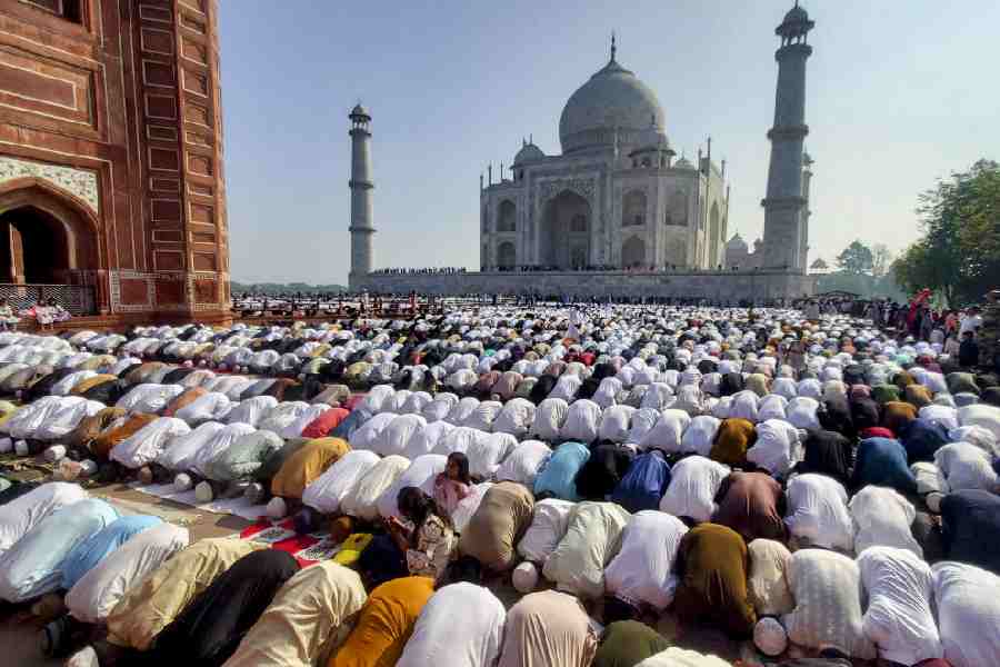 Muslims offer prayers on Eid al-Fitr, at the Taj Mahal in Agra, Uttar Pradesh, Saturday, March 21, 2026.