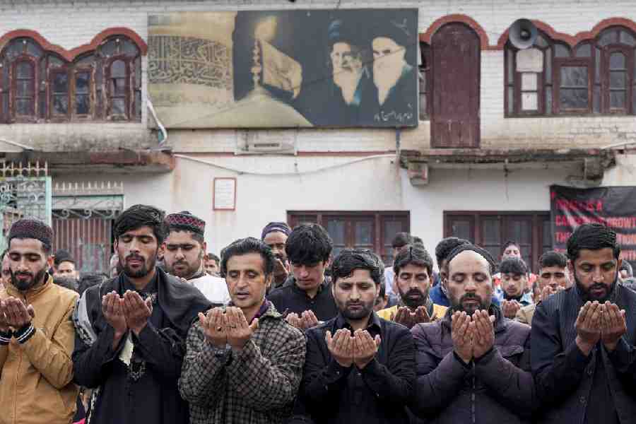 Muslims offer prayers for Eid al-Fitr, in Srinagar, Jammu and Kashmir, Saturday, March 21, 2026.