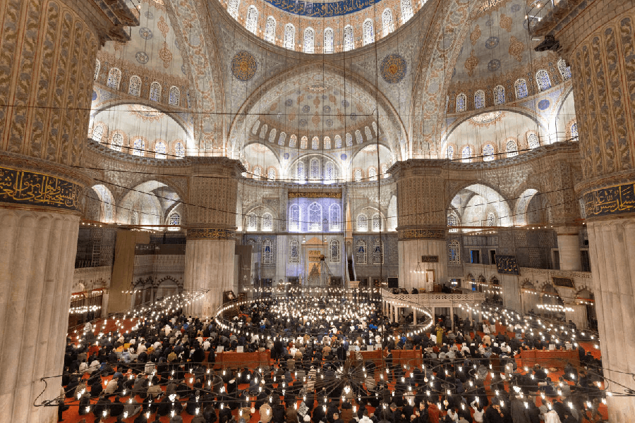 Worshippers gather at Sultanahmet Mosque, known as the Blue Mosque, to attend Eid al-Fitr prayers marking the end of the fasting month of Ramadan, in Istanbul, Turkey, March 20, 2026. 